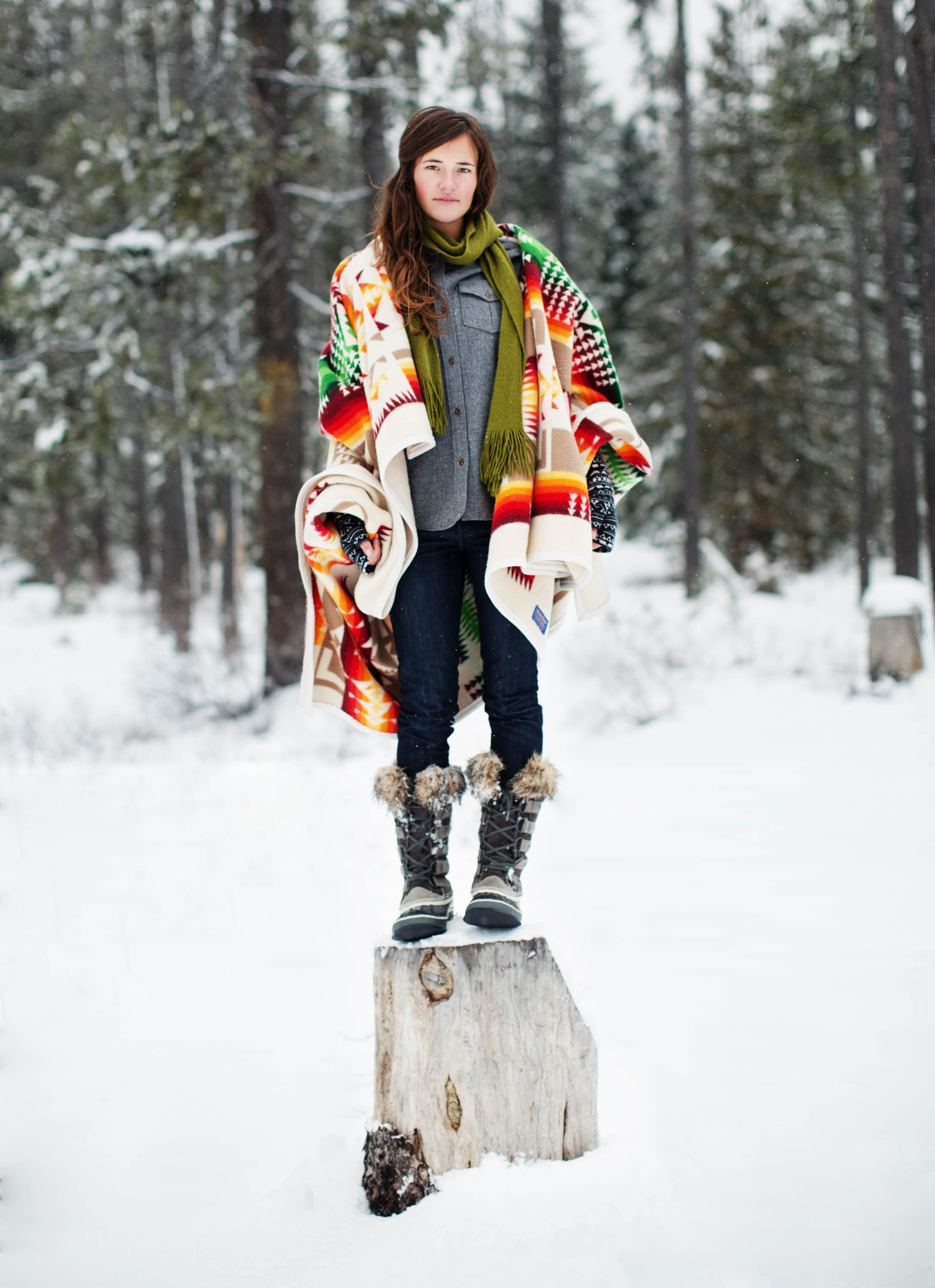 Woman on tree stump